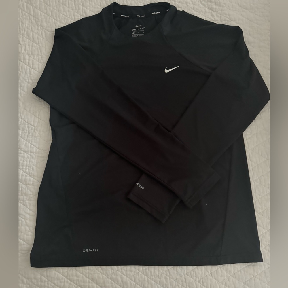 Women’s Nike swim shirt. NWOT, washed but never worn